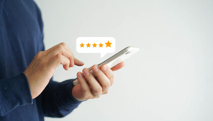 close up on customer man hand pressing on smartphone screen with gold five star rating feedback icon and press level three rank (good) for give score point to review the service business concept	 - obrazy, fototapety, plakaty