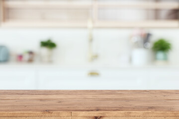 empty table board and defocused modern kitchen background. product display concept