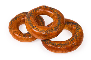 Poppy seed ring-shaped bread rolls on a white background