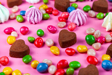 Fototapeta na wymiar Sweets on a pink table. Valentine's day.