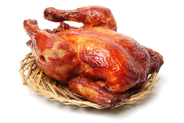 Whole roasted chicken against white background