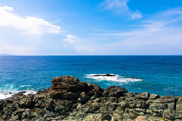 Panoramic view of the Mediterranean Sea and a natural rocky beach. Cap Corse, Corsica, France. Tourism and vacation concept.