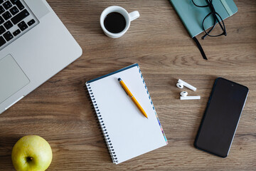Wooden desk table with different office items