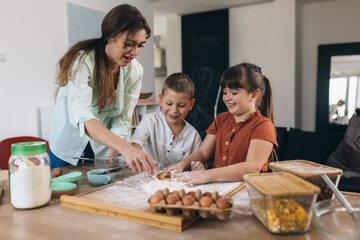 mother baking with their children at home