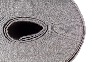 Fototapeta na wymiar roll of gray dense fabric on a white background, side view, close-up, background, texture