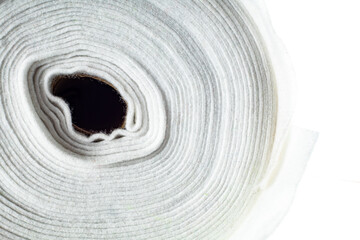 Fototapeta na wymiar roll of white fabric on a white background, side view, close-up, background, texture