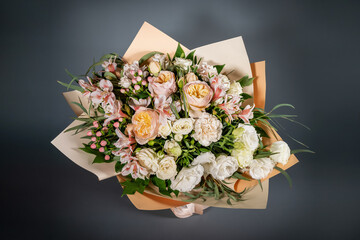 Unusual wedding stylish bouquet with pink flowers on grey dark background