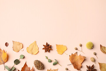 Flat lay composition with autumn leaves on light background, space for text