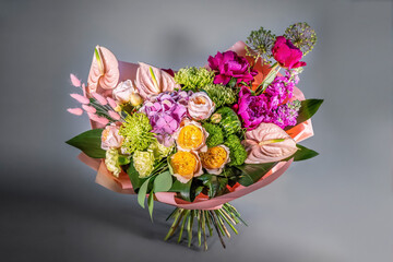 Close up wedding bouquet of flowers Isolated on a gray background. Delicate bouquet in pastel colors. Summer flowers