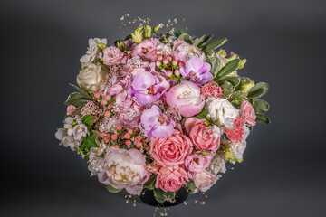 Close up wedding bouquet of flowers Isolated on a gray background. Delicate bouquet in pastel colors. Summer flowers