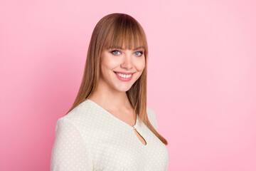 Profile side view portrait of attractive cheerful blond content girl wearing white blouse isolated over pink pastel color background