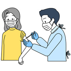 予防接種を受ける高齢女性（マスク）