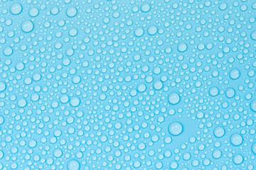 Water drops on blue background texture. Backdrop glass covered with drops of water. bubbles in water