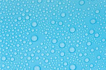 Water drops on blue background texture. Backdrop glass covered with drops of water. bubbles in water