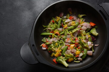Fried vegetable mixture of carrots, broccoli ,peppers, red onion and peas. Healthy food