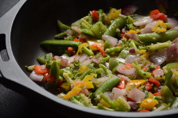 Fried vegetable mixture of carrots, broccoli ,peppers, red onion and peas. Healthy food