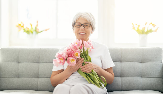 Senior Woman With Pink Flowers