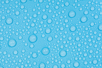 Water drops on blue background texture. Backdrop glass covered with drops of water. bubbles in water