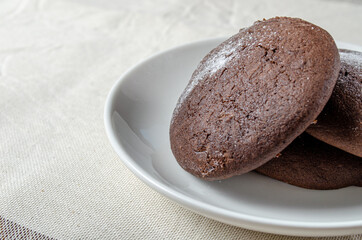 Chocolate biscuits with powdered sugar. High quality photo