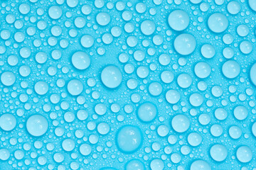 Water drops on blue background texture. Backdrop glass covered with drops of water. bubbles in water