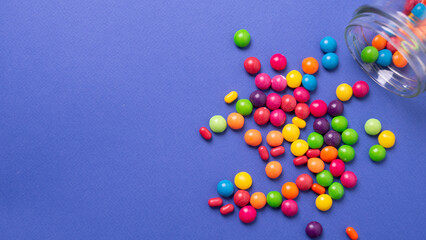 colorful little candies on a colored background