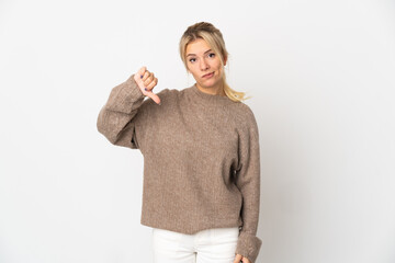 Young Russian woman isolated on white background showing thumb down with negative expression
