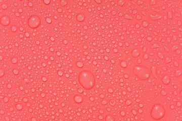Water drops on red background texture. backdrop glass covered with drops of water.  bubbles in water