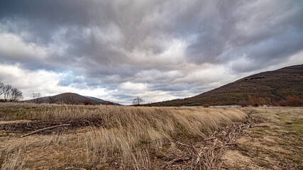 Landscape of the Lozoya reservoir in a cloudy and windy day