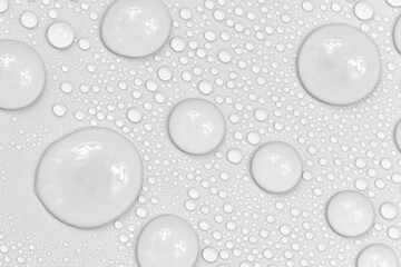 Water drops on white background texture. backdrop glass covered with drops of water.  bubbles in water