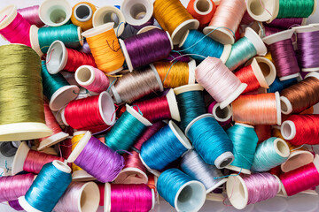Colored thread spools used in the fabric and textile industry