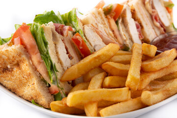 Club sandwich and French fries with ketchup sauce isolated on white background