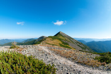 beautiful mountain valleys and mountains on a bright sunny day on the background of a wide valley