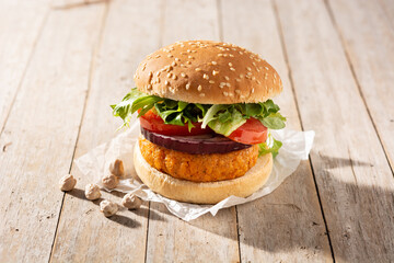 Delicious healthy chickpea burger on wooden table