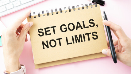 Set goals, not limits. Decision making - handwriting on a notebook