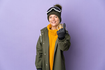 Skier Russian girl with snowboarding glasses isolated on purple background doing coming gesture