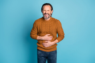 Photo of mature positive crazy funky funny smiling cheerful man laughing hold hand on stomach isolated on blue color background