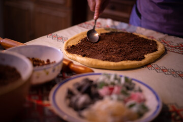 Obraz na płótnie Canvas cocoa mixed with walnuts to add to the dough of a traditional romanian cake as known as cozonac