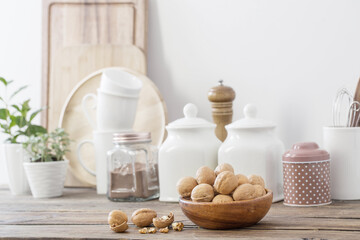 walnuts in wooden plate on kitchen
