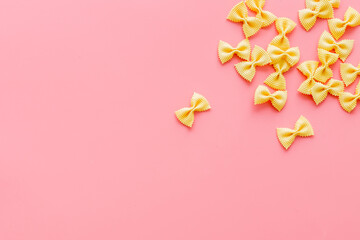 Heap of colored farfalle pasta, top view