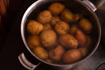 a pot of boiled potatoes at home on the stove