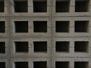 concrete wall with holes