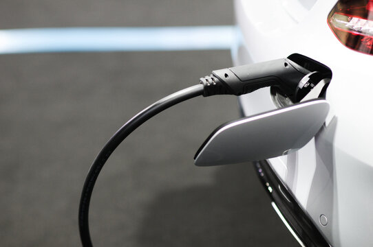 New energy Is electric power for cars Charging a new battery Future car transportation.