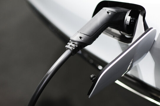 New energy Is electric power for cars Charging a new battery Future car transportation.