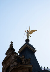 Angel statue on top of building roof
