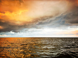 Baltic Sea under moody sky at sunset