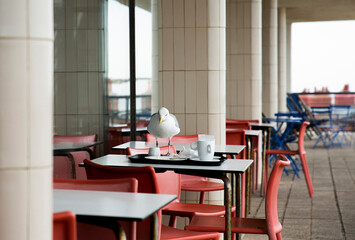 Seagull at outdoor tables in restaurant