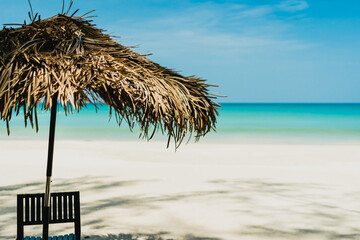 Fototapeta na wymiar Table and chair at tropical summer beach.