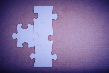 Obraz premium Assembled puzzle pieces with an empty space for inscription.