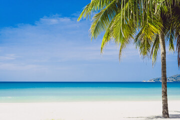 Tropical nature clean beach and white sand in summer with sun light blue sky background.