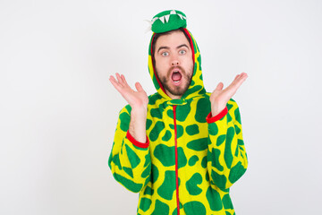 Surprised terrified young caucasian man wearing a pyjama  Gestures with uncertainty, stares at camera, puzzled as doesn't know answer on tricky question, People, body language, emotions concept